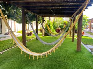 a couple of hammocks in a park at Depto Moderno Oceanna frente a playa cerritos in Mazatlán