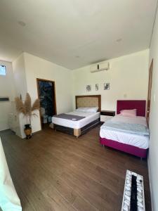 En eller flere senge i et værelse på Casa Patiño + 16 billeder