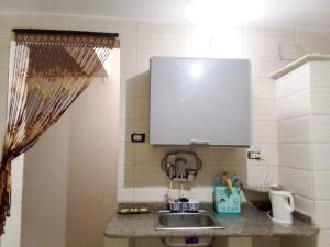 a kitchen with a sink and a counter top at Nile palace in Jazīrat Aswān