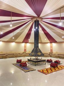 a large room with a large ceiling with a stage at Mira Bubble Luxury Camp in Wadi Rum