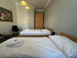 a hotel room with two beds in a room at Mariazellerhof Suite 016 in Sankt Pölten