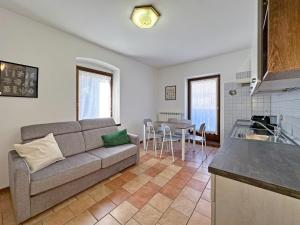 a living room with a couch and a table at BBkey Borgo Living Sutrio in Sùtrio