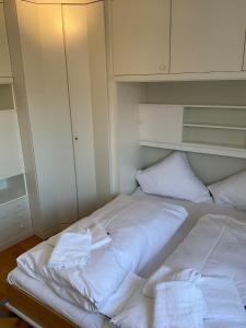 a bedroom with two beds with towels on them at Marienkirche 2 - ABC336 in Wismar