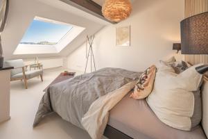 a bedroom with a bed with a pillow and a window at Ferienhaus Daheim in Sankt Peter