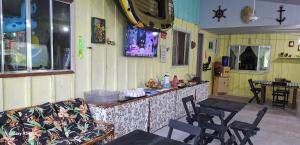 Et tv og/eller underholdning på Pousada Mamangaba de Ubá