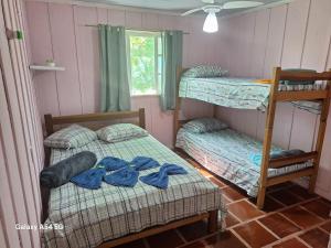 En eller flere senge i et værelse på Pousada Mamangaba de Ubá