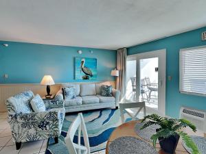 a living room with a couch and a table at Perdido Skye #54 in Perdido Key