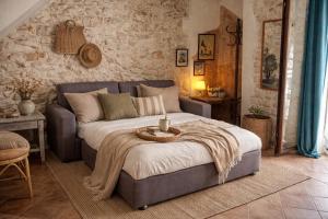 a bedroom with a bed with a table on it at Dimora delle Badesse in Conversano