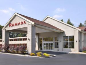 a rambala building with a sign on it at Ramada by Wyndham Cleveland Airport West in Fairview Park
