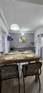 a dining room with a table and two chairs at Temporario CNQ in Corrientes