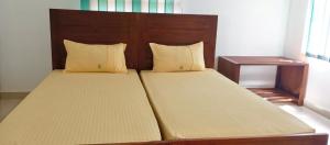 En eller flere senge i et værelse på Wild trails -Yala