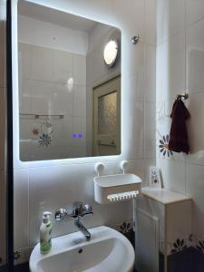 A bathroom at Sunny Central Apartment