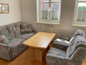 a living room with a couch and a table at Marienkirche 1 - ABC335 in Wismar
