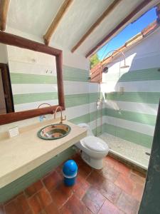 a bathroom with a sink and a toilet at Posada Sueños de Antonio in Barichara