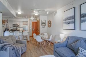 a living room with a couch and a table at Rimfire 342: Memory Maker, Walk to Shops, Slope Side in Slaty Fork