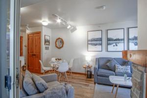 a living room with a couch and a table at Rimfire 342: Memory Maker, Walk to Shops, Slope Side in Slaty Fork
