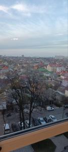 a view of a city with cars parked in a parking lot at Aкварель на Черемушках in Odesa