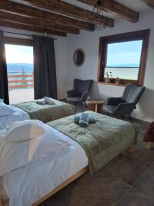 two beds in a room with a view of the ocean at Na szlaku Baraniej Góry in Istebna