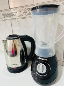 a blender sitting on top of a counter at Apartamento 4 quartos Contagem in Contagem
