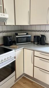 מטבח או מטבחון ב-Modern Nyborg Suites +9 תמונות