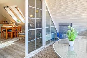 a room with a glass table and a dining room at Ostseeauszeit in Prerow