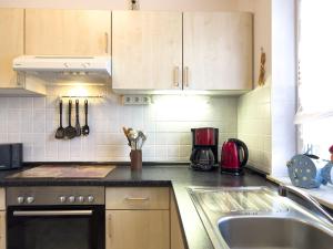a kitchen with a sink and a counter top at Inselperle in Zingst