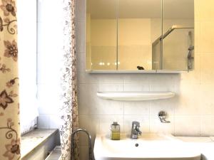 a bathroom with a sink and a mirror at Inselperle in Zingst