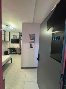 an open door to a room with a table at Adhoc Fundidora in Monterrey