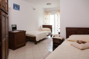 Postel nebo postele na pokoji v ubytování Rooms Vesna