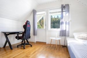 En eller flere senge i et værelse på Fantastisk opplevelse i sør! Nydelig & avslappende