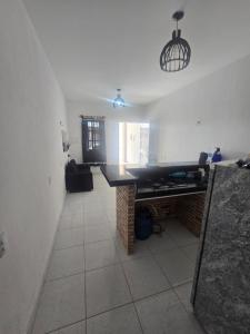 a living room with a large black table in a room at Casa Maúna in Prea
