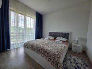 En eller flere senge i et værelse på Pensiunea Agroturistica Acvila Apusenilor