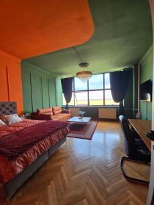 En eller flere senge i et værelse på Diamond Apartments Niš