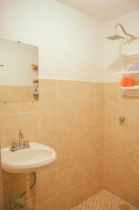 a bathroom with a sink and a mirror at Hostal Guadalajara in Guadalajara +22 photos