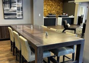 a large wooden table and chairs in a room at Residence Inn Paducah in Paducah +6 photos