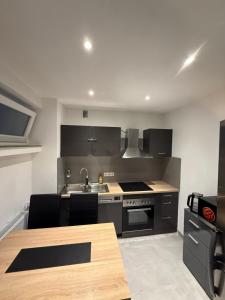 a kitchen with a sink and a stove at Ferienwohnung-Montagewohnung 4 in Paderborn