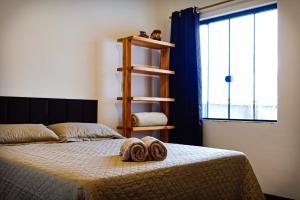 En eller flere senge i et værelse på Hospede-se em Tiradentes - apartamento e suite