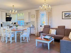 a living room with a couch and a table at Ruheoase in Prerow