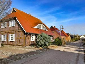 a large house with an orange roof at Ruheoase in Prerow