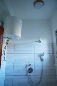 a bathroom with a shower with a shower head at Kings Land Hotel in Lalībela