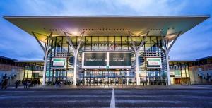 a large building with a lot of windows at Studio Cosy Le Cocon au calme in Saint-Bonnet-de-Mure