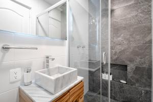 a bathroom with a sink and a shower at Casa Ama in Mexico City +60 photos