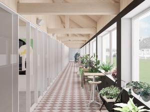 an internal corridor of a building with potted plants at Propice in Le Palais