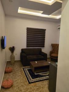 a living room with a couch and a coffee table at Rehoboth in Mama