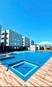 a large swimming pool on top of a building at NG Flat seu refúgio do mar in João Pessoa