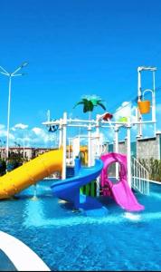 a water park with a slide in the water at NG Flat seu refúgio do mar in João Pessoa