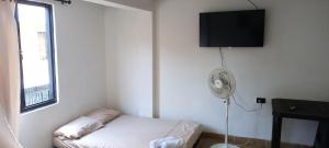 Giường trong phòng chung tại La Posada De Shaz En Norcasia