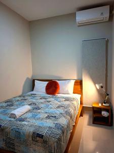 Postel nebo postele na pokoji v ubytování Omi Homestay