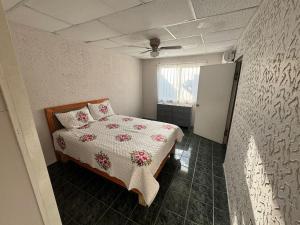 a bedroom with a bed and a window in it at Casa visas656 in Manuel F. Martínez +3 photos