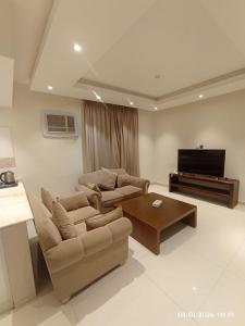 TV/trung tâm giải trí tại لؤلؤة راحتي للشقق الفندقية